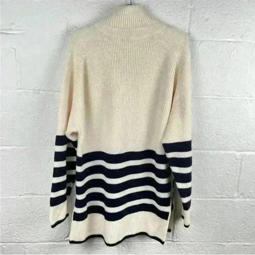 COS Roll neck sweater in white and black striped wool and cotton blend
